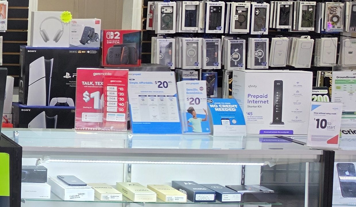 PlayStation 5 Slim and Nintendo Switch 2 boxes on display at TIC Wireless Electronic & Repair Center