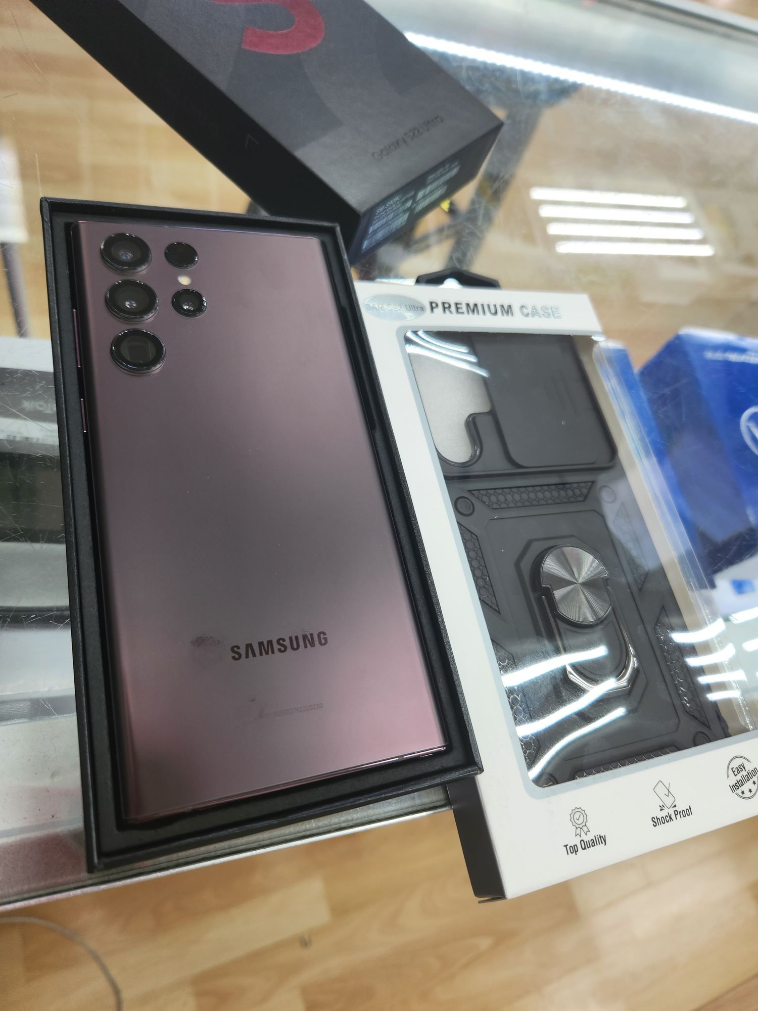 Samsung Galaxy S22 Ultra on the counter next to a rugged case
