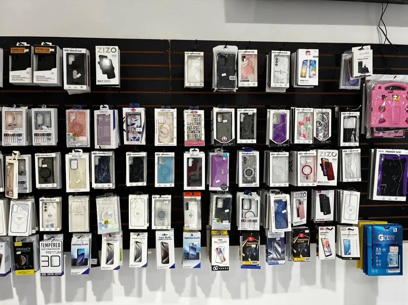 Samsung Galaxy cases on the wall at TIC Wireless