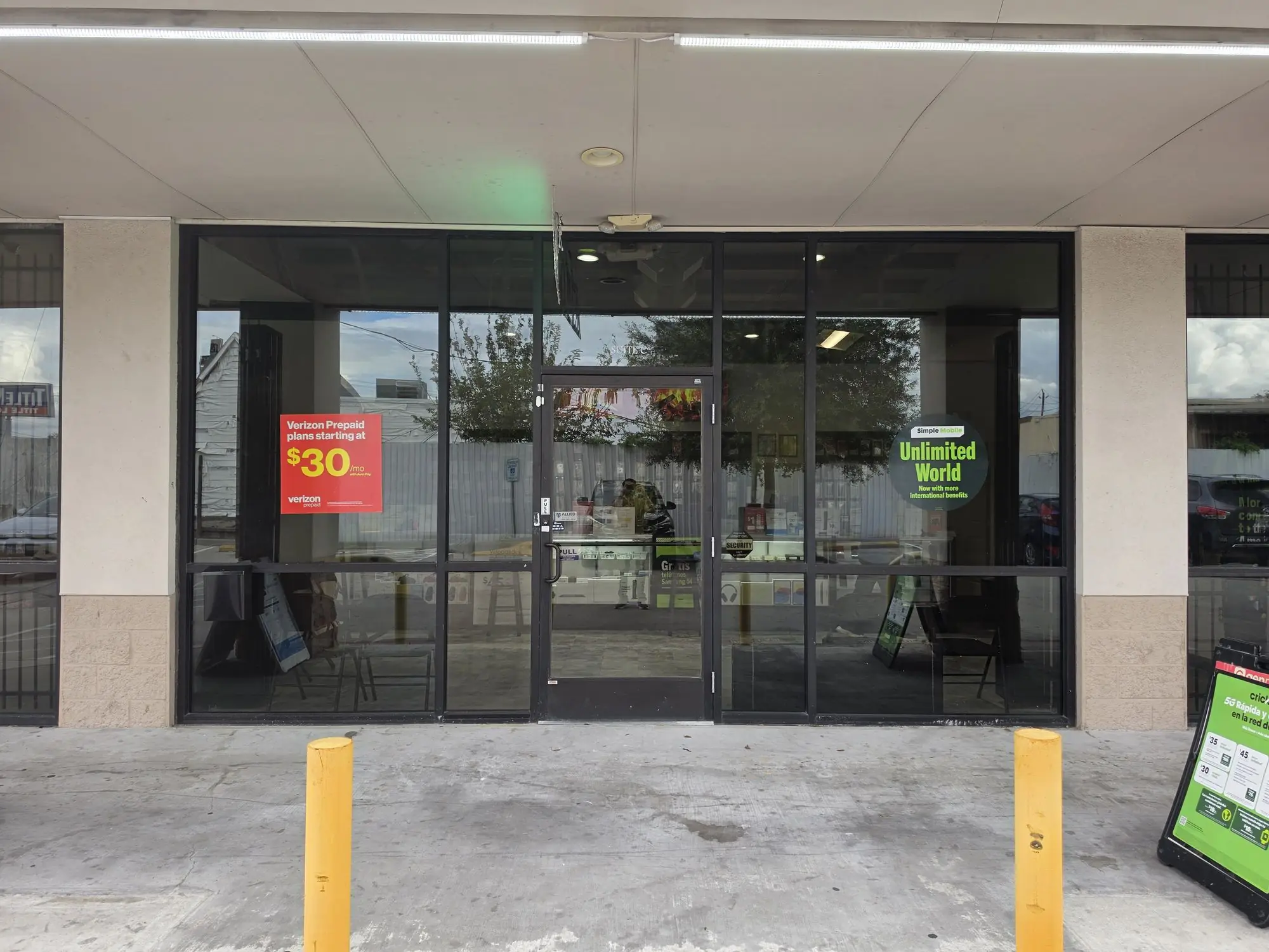 The glass storefront of TIC Wireless Electronic & Repair Center at 3640 Hillcroft St, Suite C, Houston